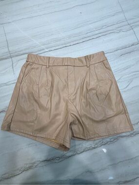 High-Rise Faux Leather Shorts in Nude